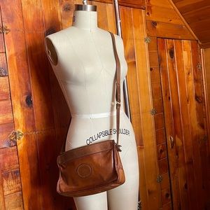 Vintage leather Brahmin cross body purse.